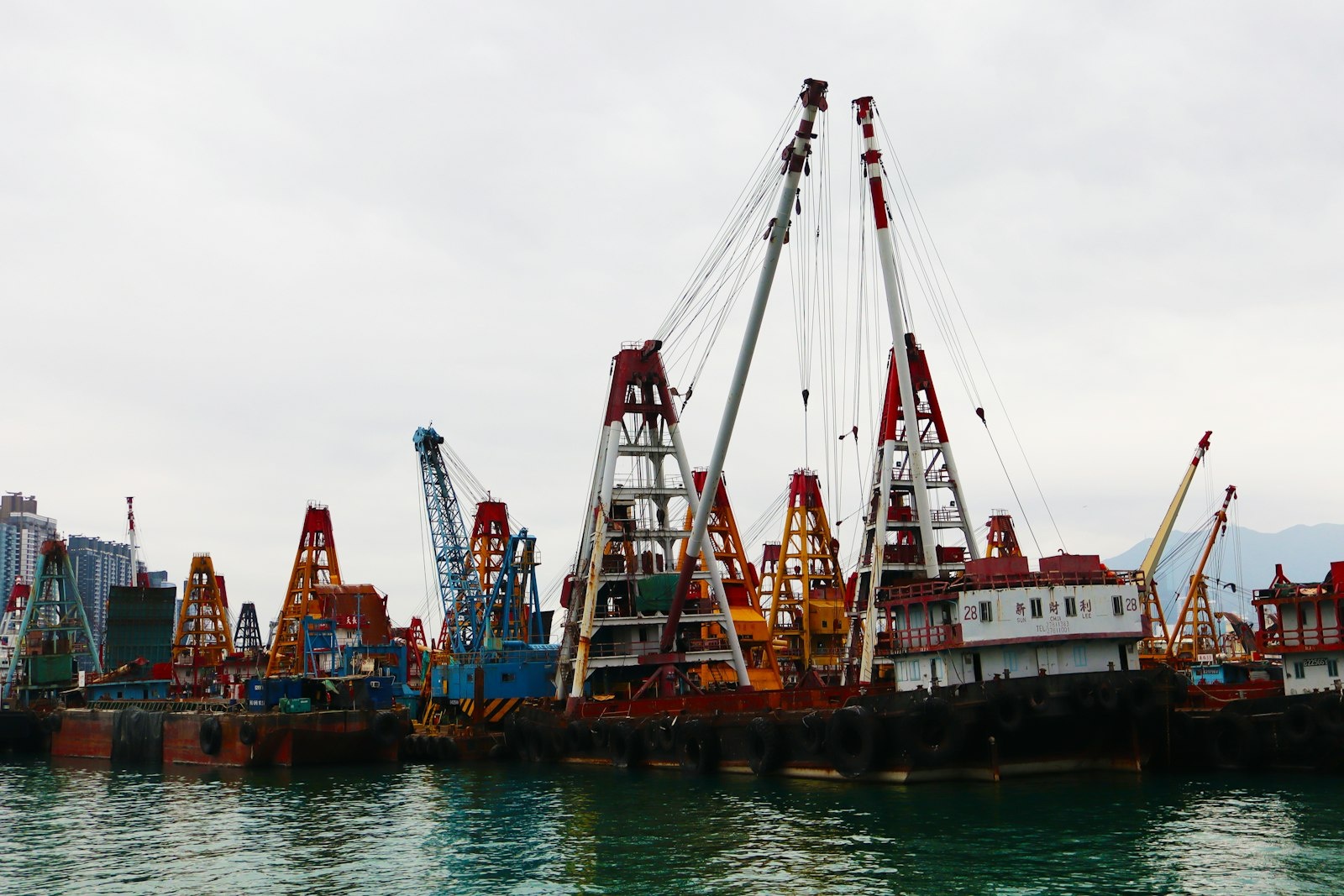 Construction cranes by Hong Kong's harbour